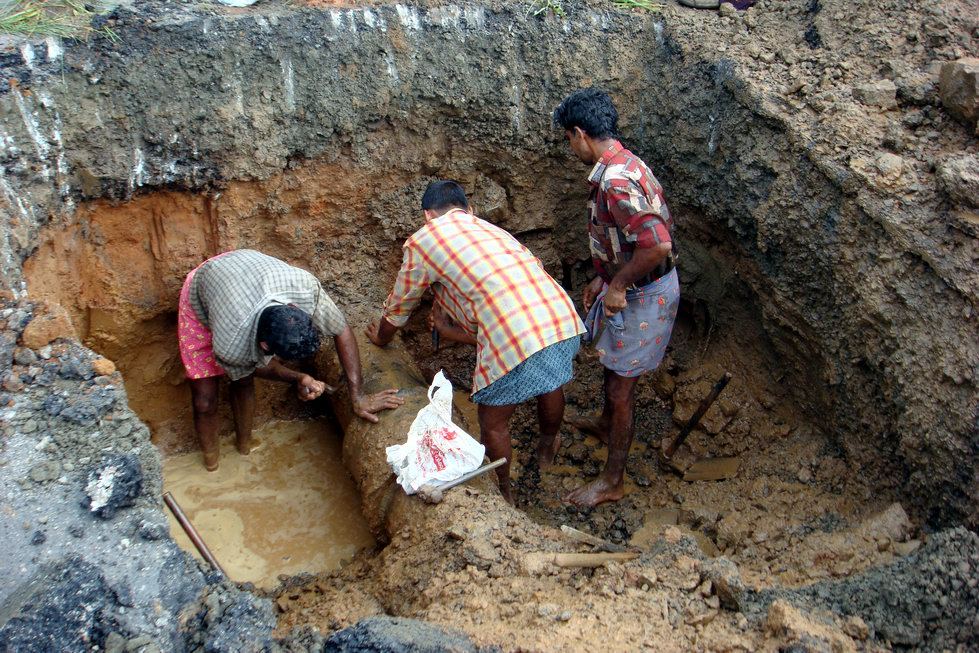 Water Pipe Repairs Get a Trenchless Option at Scale workers repairing underground water pipes